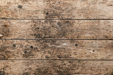 Wall Mural - Brown rustic aged wooden plank rough background or  dry textured wood panel weathered backdrop  with stains and cracks.