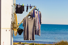 Caravan On Beach With Clothes To Dry