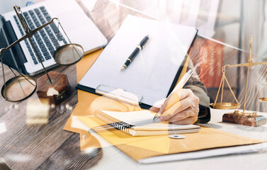 Business and lawyers discussing contract papers with brass scale on desk in office. Law, legal services, advice, justice and law concept picture with film grain effect