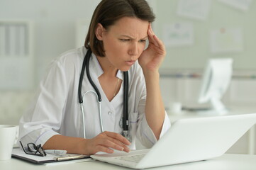 Portrait of  sad  female doctor in hospital