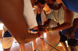 © Wavebreak Media - Diverse male basketball team and coach in huddle teaming up