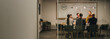 © Jacob Lund - Creative team applauding woman executive in meeting
