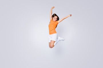 Sticker - Full length photo of excited lady player soccer team jump up raise fists champion league wear football uniform t-shirt shorts cleats long knee socks isolated white color background