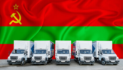 Transnistria flag in the background. Five new white trucks are parked in the parking lot. Truck, transport, freight transport. Freight and logistics concept