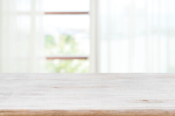 Wall Mural - table top for product display on blur curtained window view