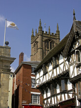 Attractive Timber-framed Buildings In Broad Street, With The Parish Church Tower Of St Laurence, In The Ancient Town Of Ludlow, Shropshire, England, UK