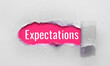 © loran4a - inscription Expectations word on blue torn papper