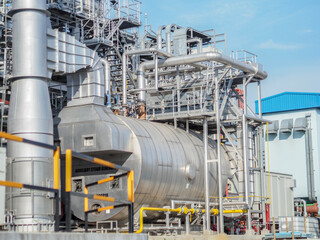 Wall Mural - Auxiliary boiler systems from natural gas which include stack, burner, boiler and sky in power plant.