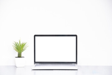 Laptop on table with white background