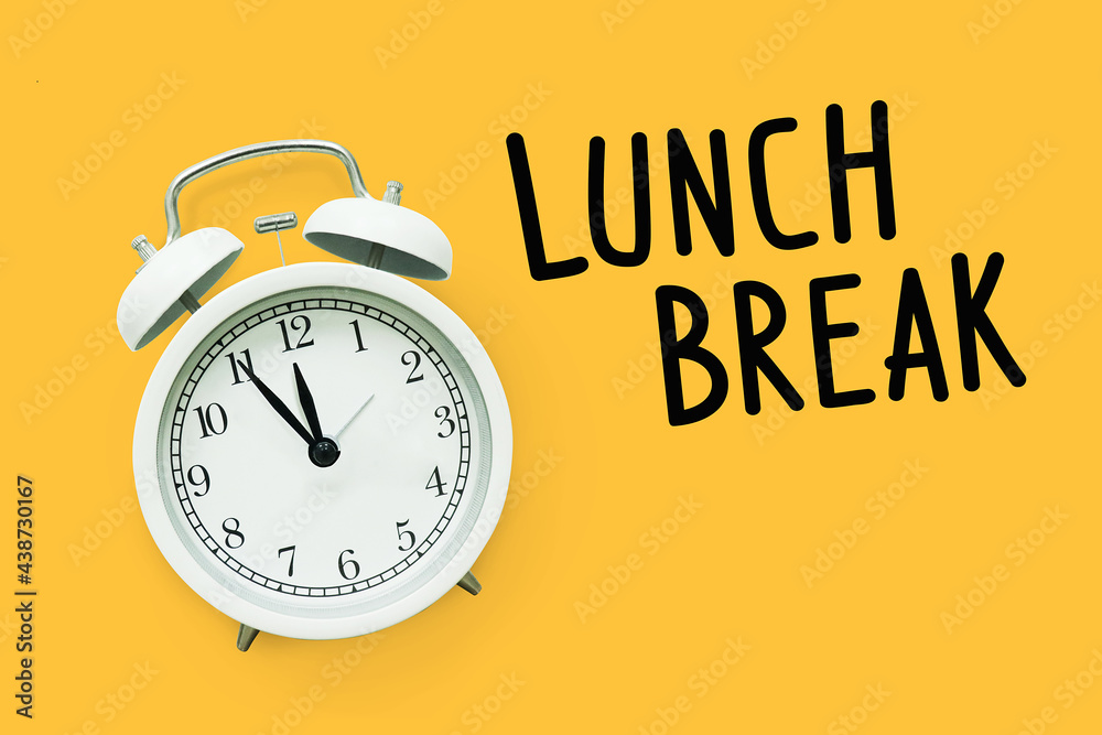 What Time Is It It's Time For Lunch Lunch break time,Time for Lunch, Alarm clock on yellow background Stock