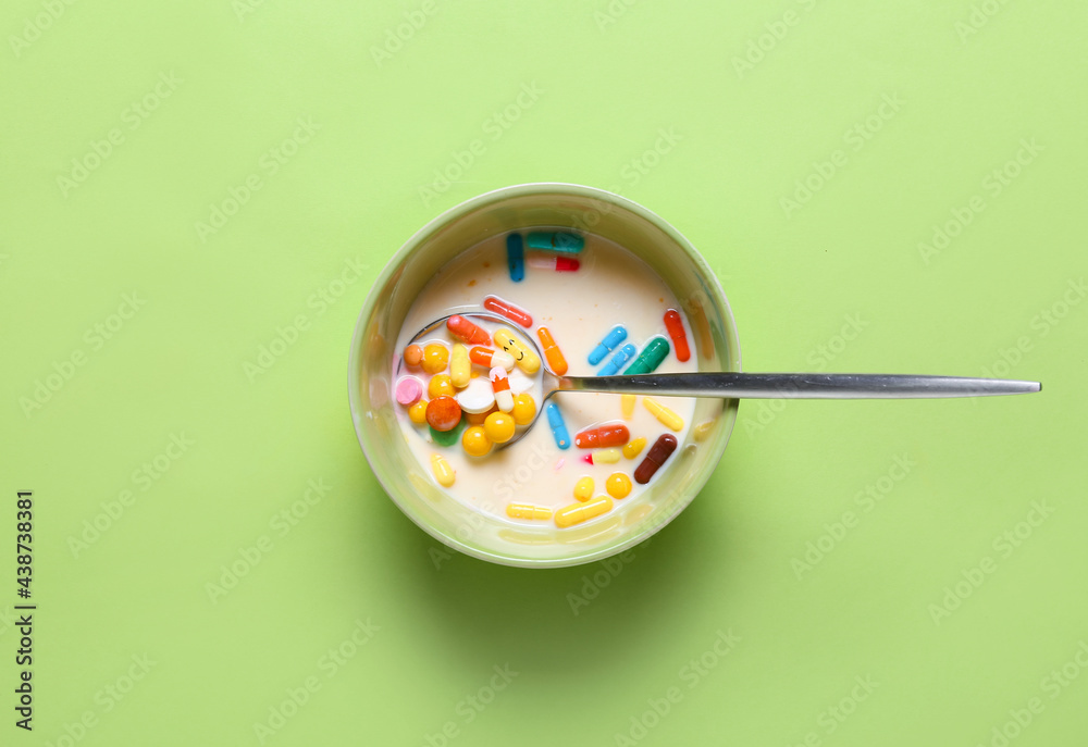 Bowl with pills and milk on color background. Concept of addiction