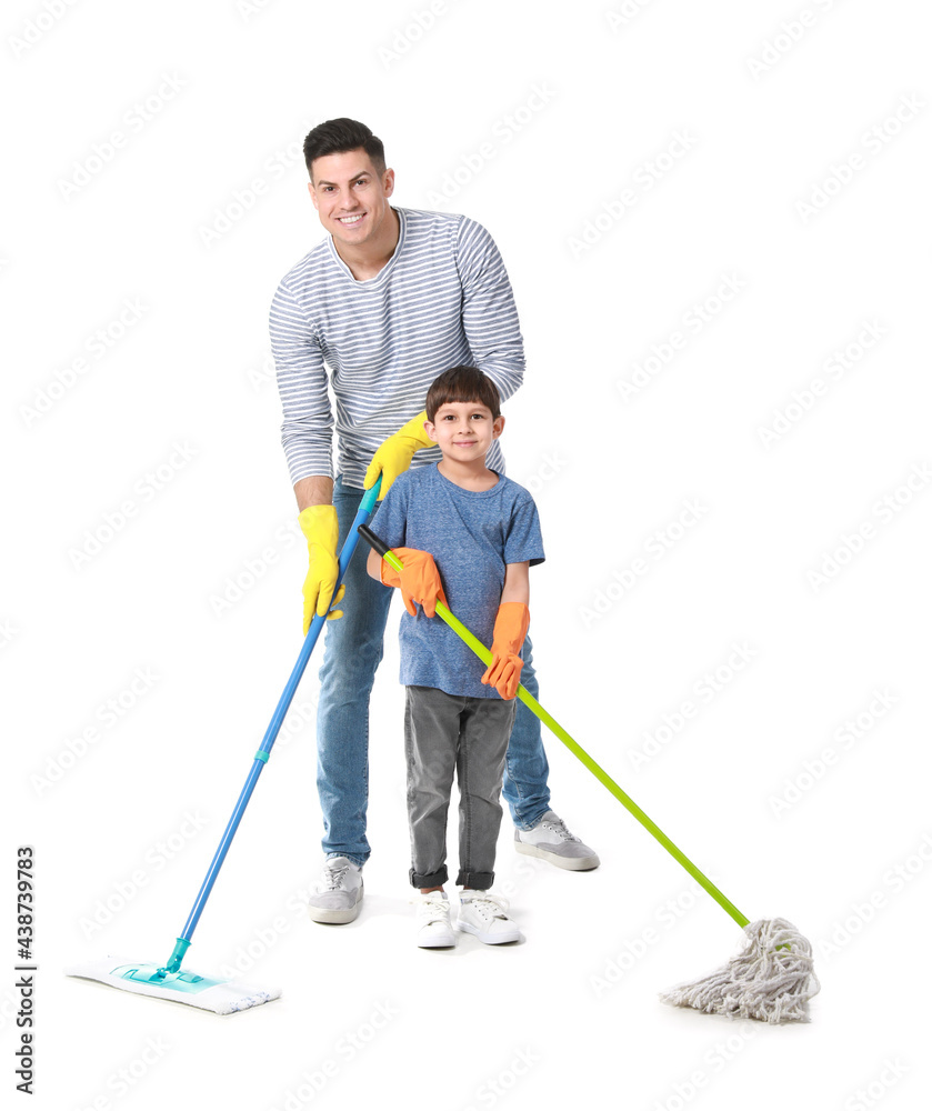 Father and son mopping floor on white background