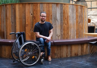 Wall Mural - man in wheelchair sitting in restaurant