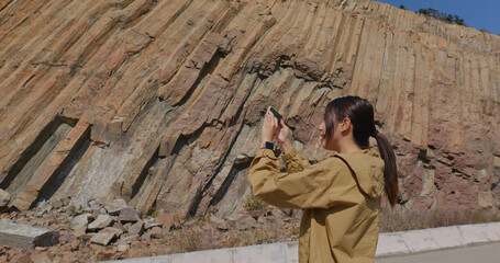 Canvas Print - Woman take photo on cellphone in Geopark