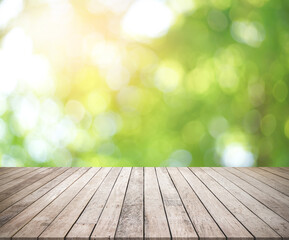 Wall Mural - Old wood plank with abstract natural green blurred bokeh background for product display