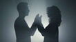 © stockbusters - Sensual couple silhouette holding hands indoors. Lovers standing in dark space