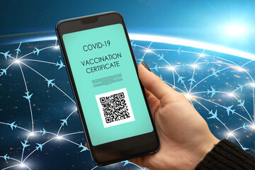 digital green certificate, vaccination passport on mobile app for travel tourism,hand with smartphon
