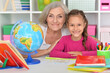 © aletia2011 - Little girl doing homework with her grandmother at home