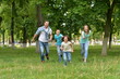 © aletia2011 - Portrait of happy young family  running in summer  park