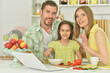 © aletia2011 - family cooking together at kitchen table