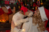 Fototapeta Panele - Dog near fireplace and Christmas tree, gift boxes