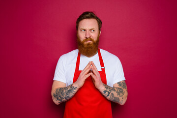 Wall Mural - doubter isolated chef with beard and red apron