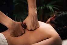 Hands Of A Female Therapist Doing A Deep Tissue Back Massage