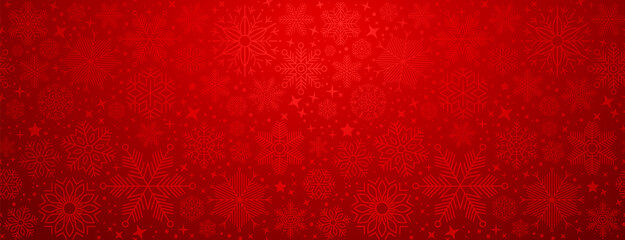 Wall Mural - christmas illustration with various small snowflakes on gradient background in red colors