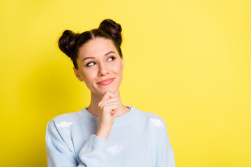 Wall Mural - Photo of minded smart lady look empty space finger chin wear blue pullover isolated yellow background