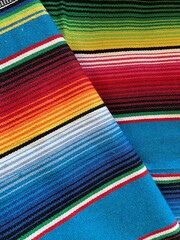 Wall Mural - poncho background Cinco de mayo Mexican serape fiesta falsa pattern traditional culture blanket with stripes pattern copy space fabric textile material Mexican backdrop - stock photo photograph image