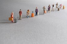 Vacation Travellers In Queue