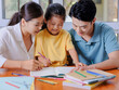 © eastfenceimage - Young parents help their children with their homework