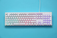 Modern RGB Keyboard On Turquoise Background, Top View
