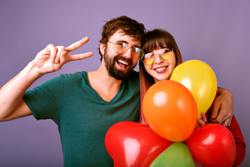 Wall Mural - Bright positive studio lifestyle portrait of couple hipsters having fun,