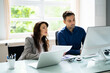 © Andrey Popov - Meeting And Discussion At Office Desk