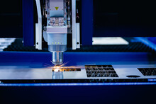 Laser CNC Cut Of Metal With Light Spark Blue Color, Technology Industrial Modern