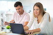 © auremar - happy couple with laptop at home