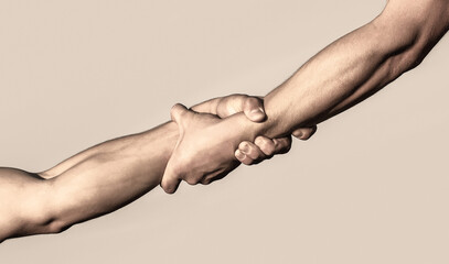 Two hands, helping arm of a friend, teamwork. Rescue, helping gesture or hands. Close up help hand. Helping hand concept, support