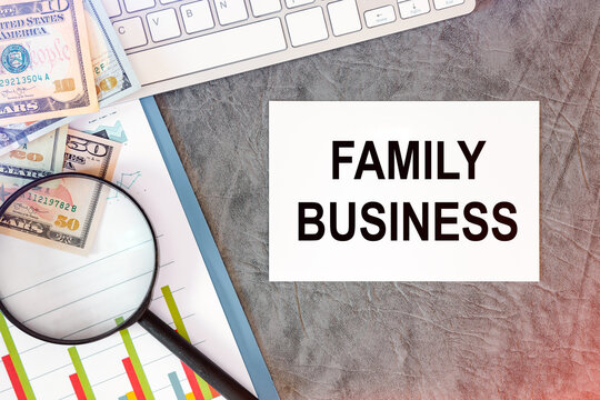 FAMILY BUSINESS is written in a document on the office desk, keyboard and diagram