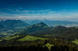Panoramic landscape view of the Swiss Alpes,with blue sky in the background, shot in La Berra, Gruyère, Switzerland
