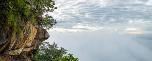 The atmosphere of the clouds and white mist in the mountains At Pha Mo E Daeng, Sisaket Province, Thailand.