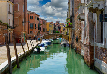 Wall Mural - Narrow canal with bridge in Venice, Italy. Architecture and landmark of Venice. Cozy cityscape of Venice.