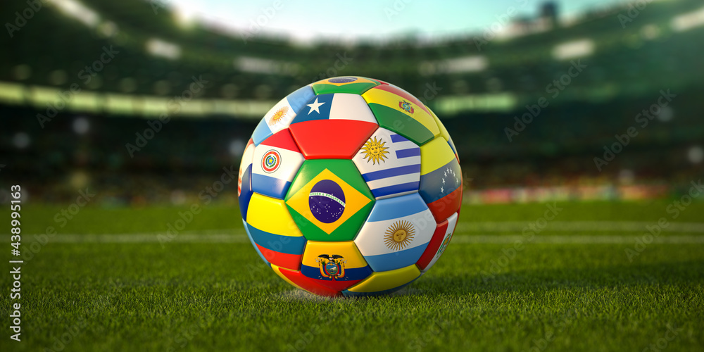 Soccer Football ball with flags of south america countries on the grass of football stadium. America championship 2021. - obrazy, fototapety, plakaty 