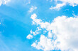 © KatMoy - Simple beautiful gloomy blue sky with fluffy clouds in summer morning peace day as a background. Gray, white and turquoise color blurred skyline texture photography.