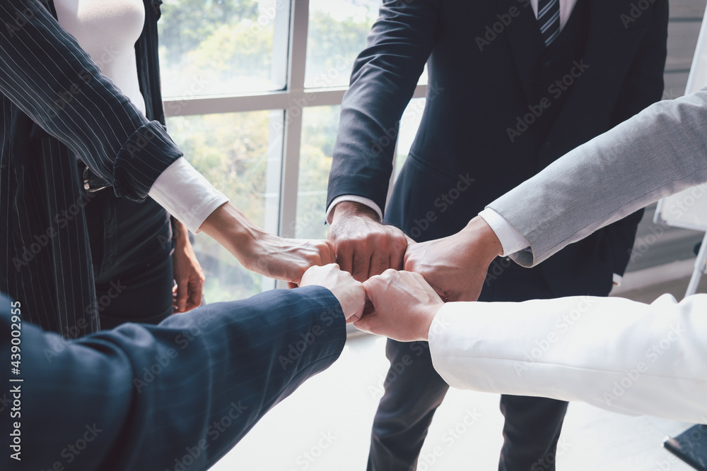 businessman and woman putting hands fist join together, business ...