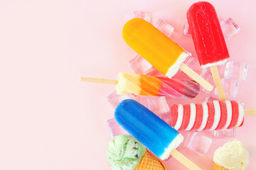 Leinwandbilder - Selection of colorful summer popsicles and ice cream treats. Above view scattered on a pink background. Copy space.