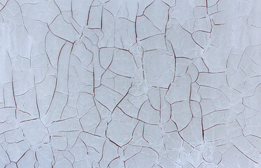 Cracks background from old light gray paint