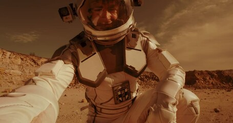 Wall Mural - Male astronaut recording video on Mars