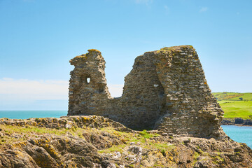 Ruins of The Black Castle and a view of the Wicklow sea in the background.