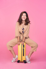 Beautiful Attractive Asian Woman Smiling Happy Excited Traveling Holiday Summer Vacation Trip Packing Suitcase Luggage Bag Wearing Sunglass Overall Fashion Posing Model Pink Isolated Background